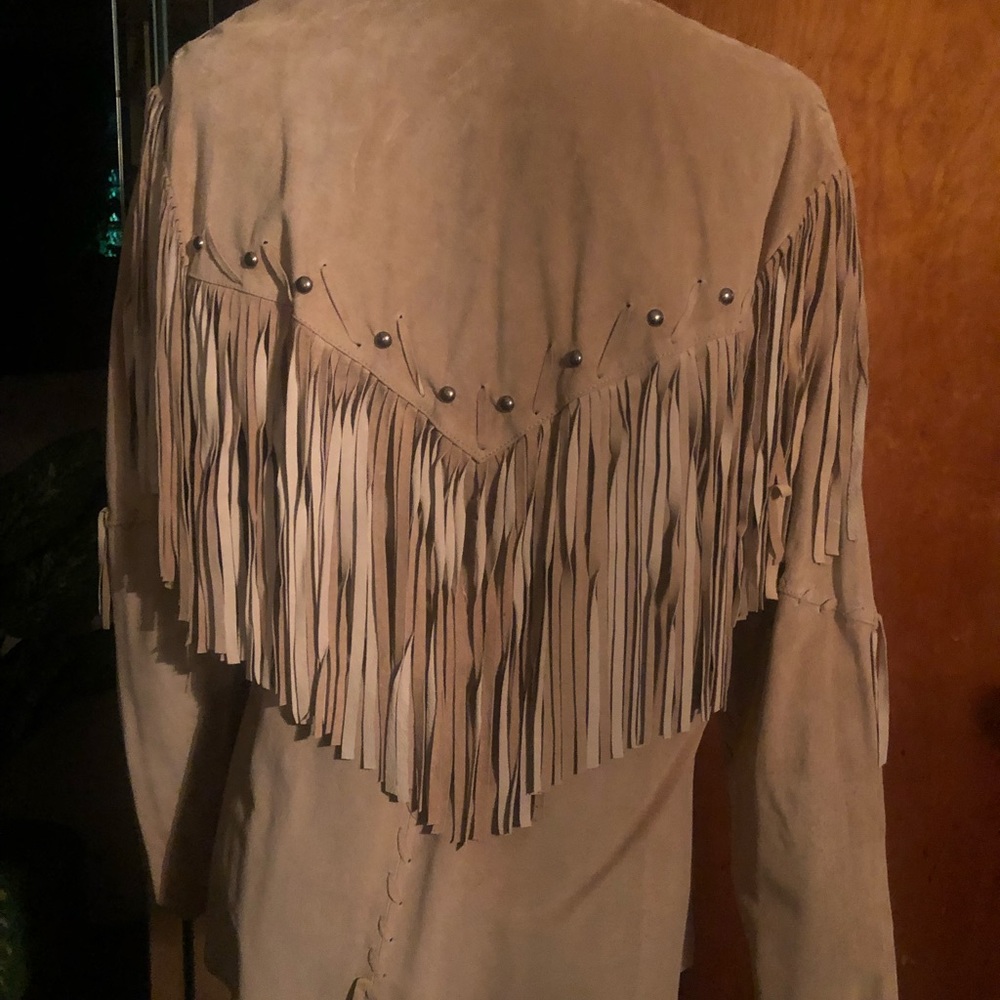 Beige fringed blazer with studded collar .